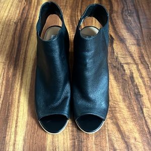 Peep toe booties with open back.